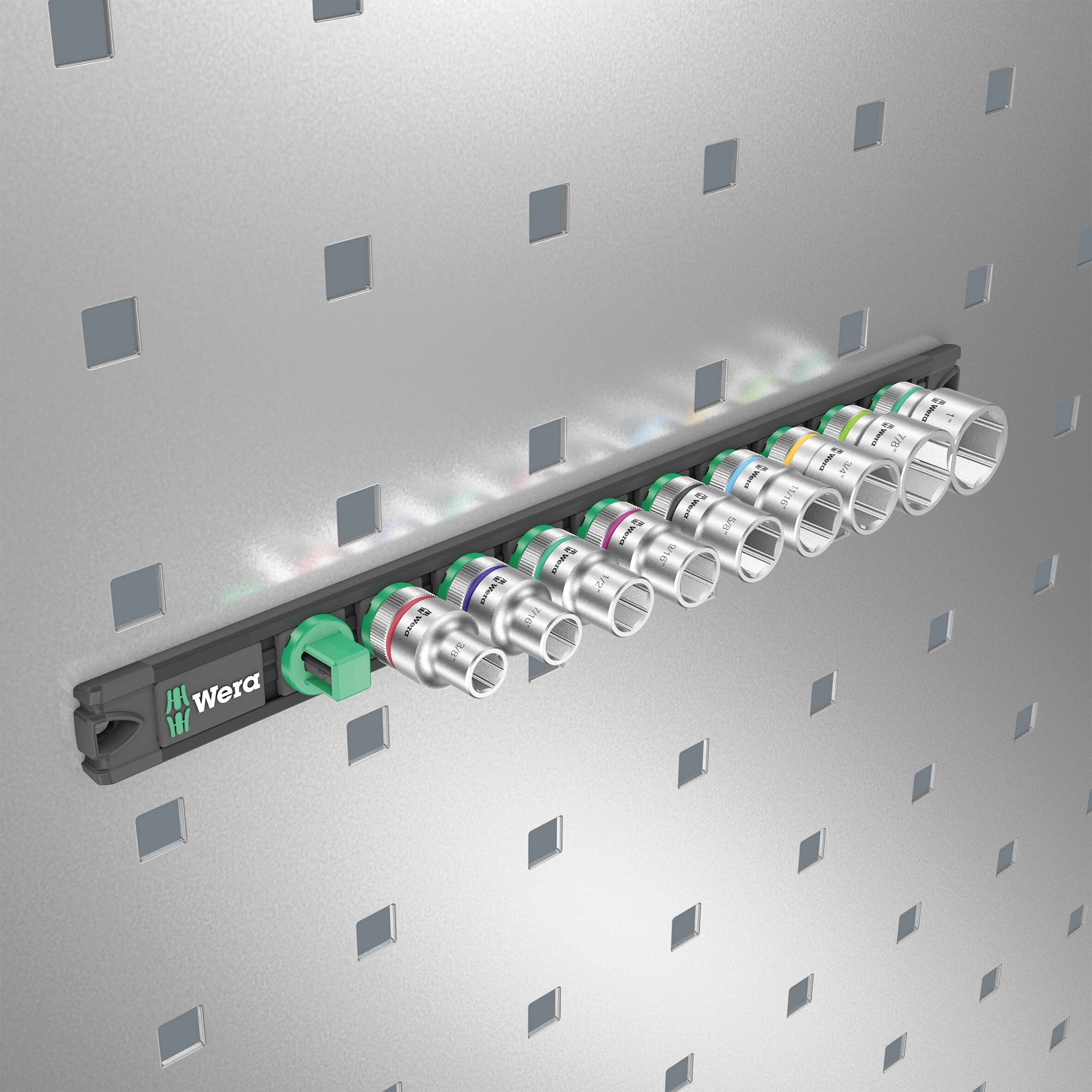 A selection of socket wrenches is attached to a pegboard, arranged by size and mounted on a green tool holder.