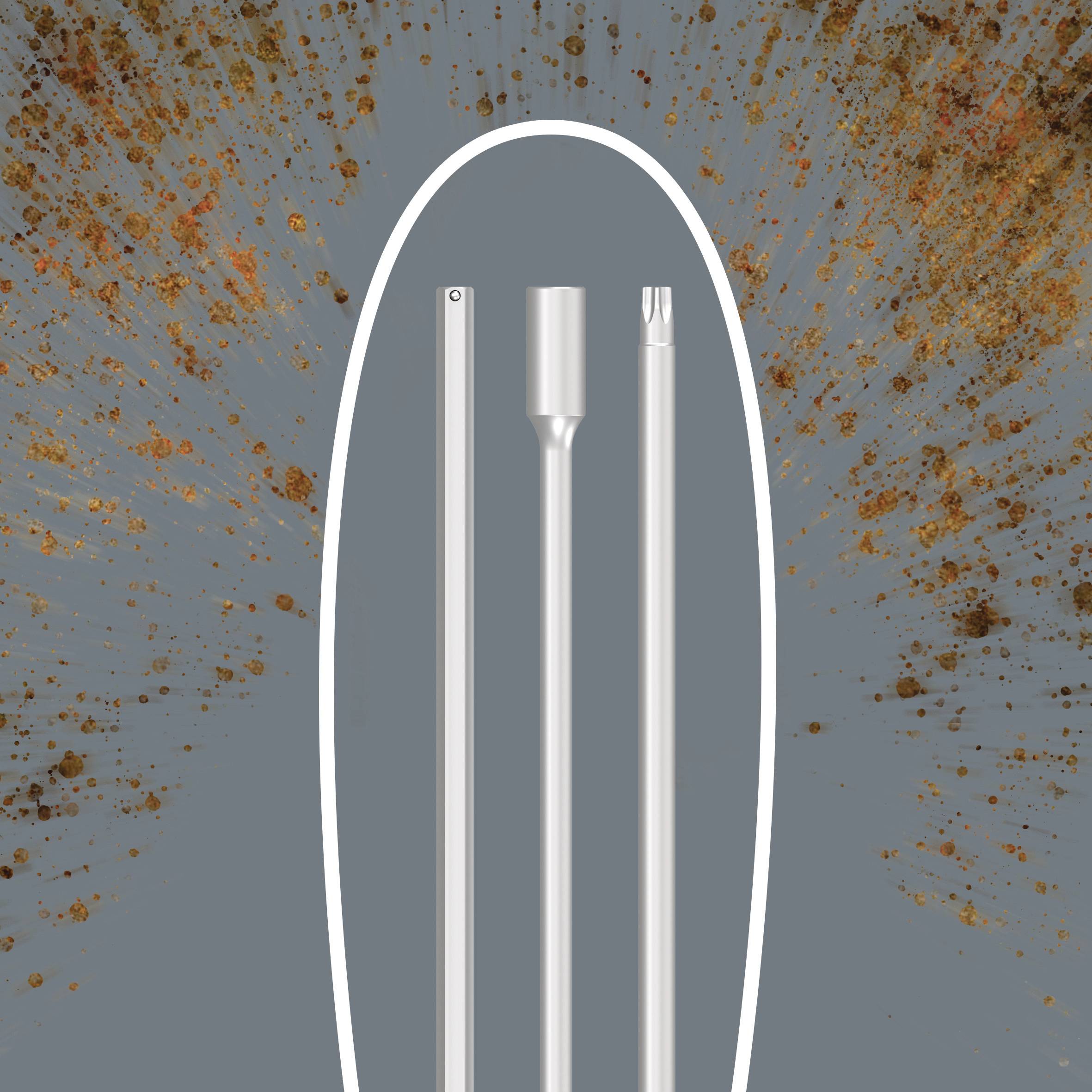 'Three differently shaped and long metal rods on a grey, speckled background.'