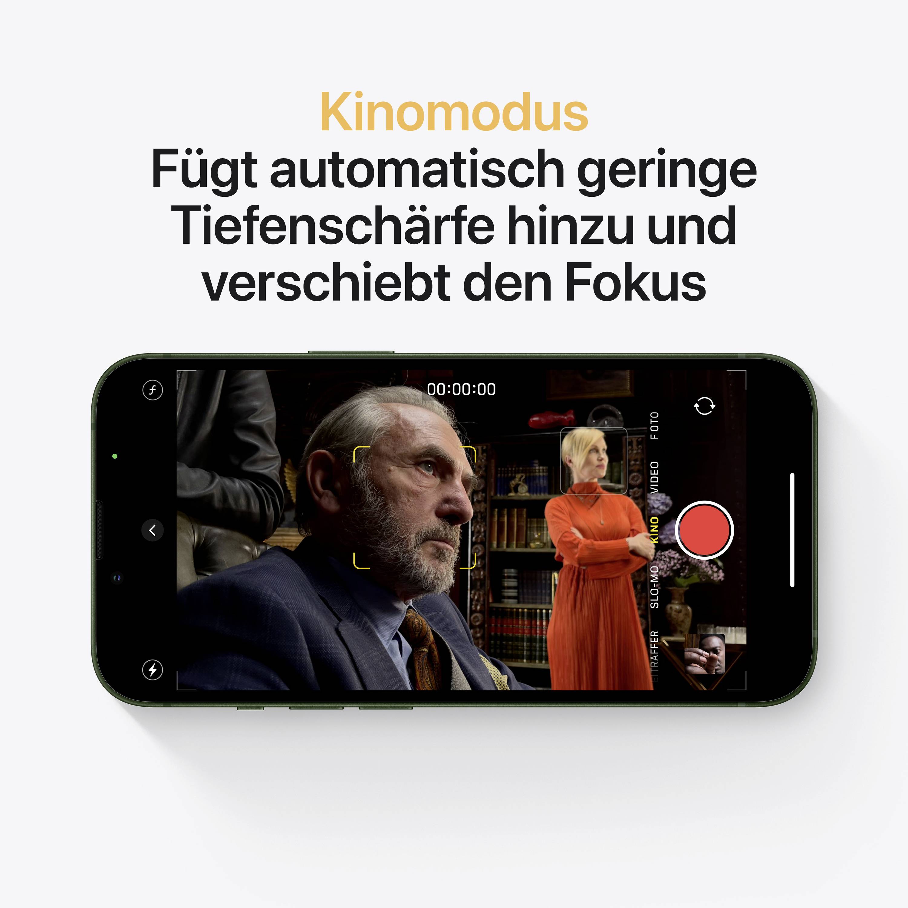 Mobile phone on table showing 'Cinema mode' in camera app. Image: Man in suit and woman in red dress in background. Text at the top explains function.