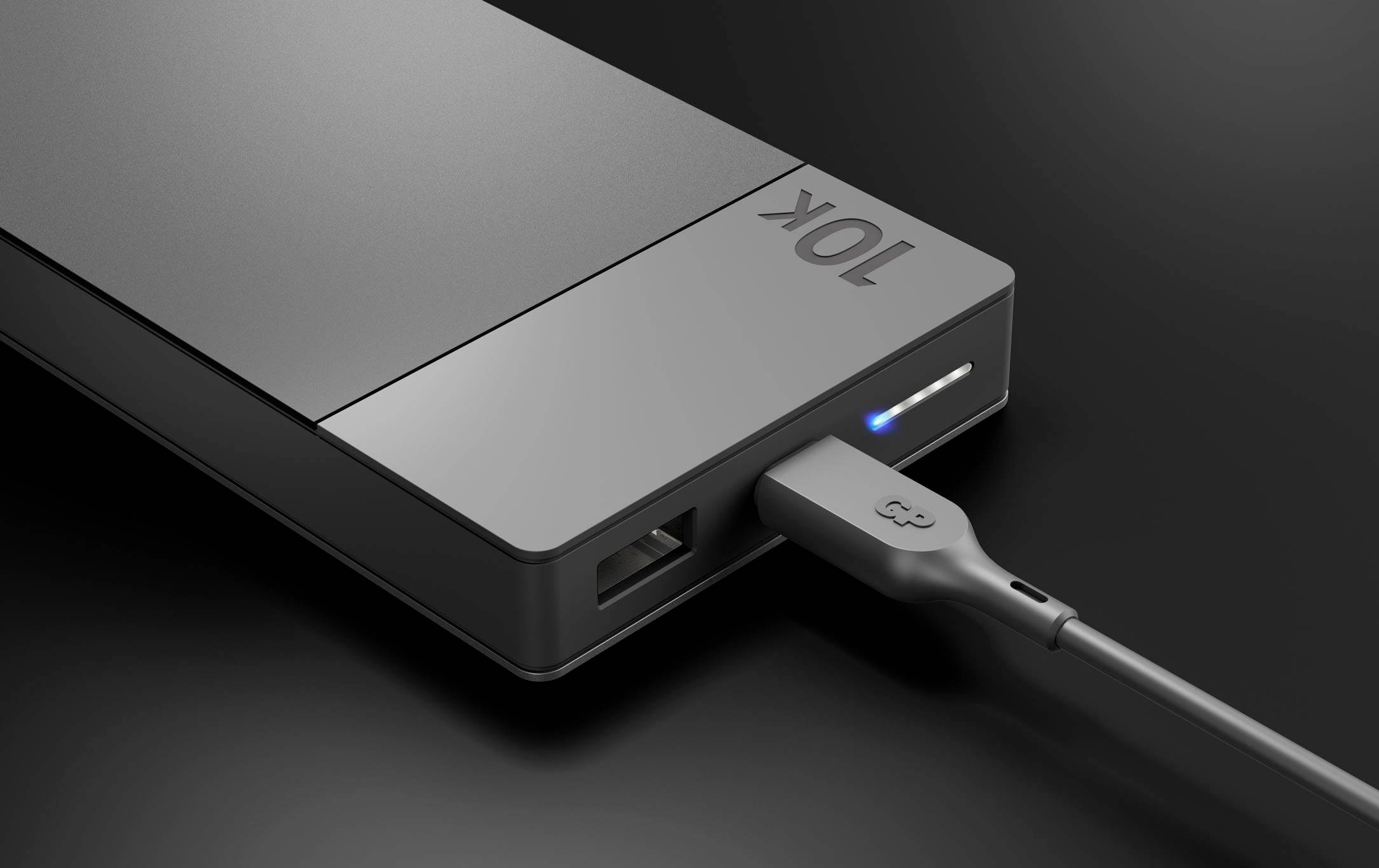 Power bank with USB port and cable. Blue LED indicator lights up, indicating that the device is switched on or in operation.