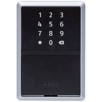 An electronic number lock with digit keys from 0 to 9 and two function buttons, mounted on a silver plate.