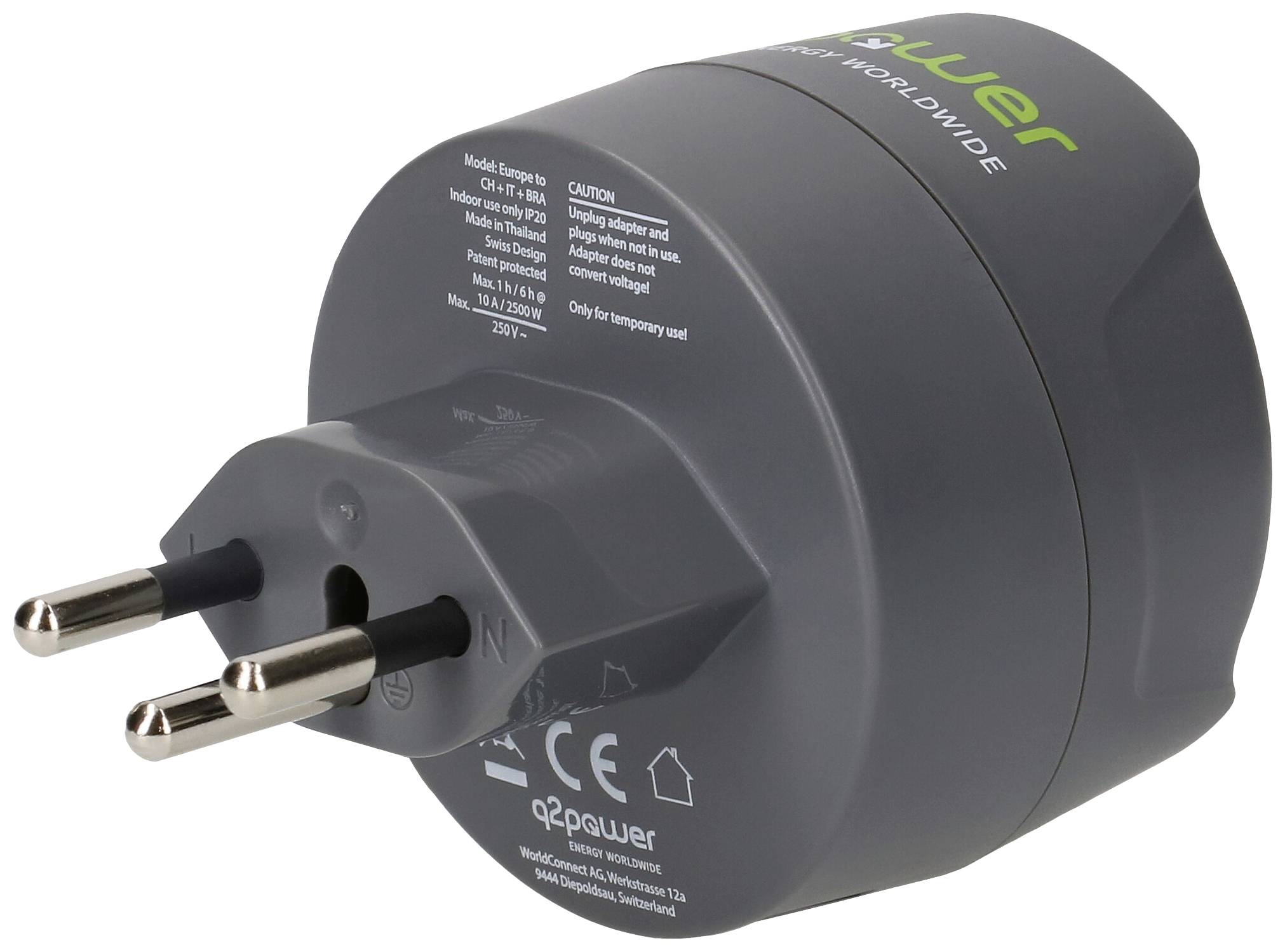 A grey travel plug adapter with EU plug, suitable for international use. Product details and safety information on the surface.
