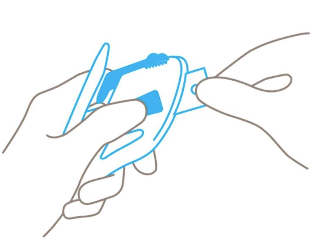 A hand is holding a blood glucose meter while the other hand inserts a test strip.