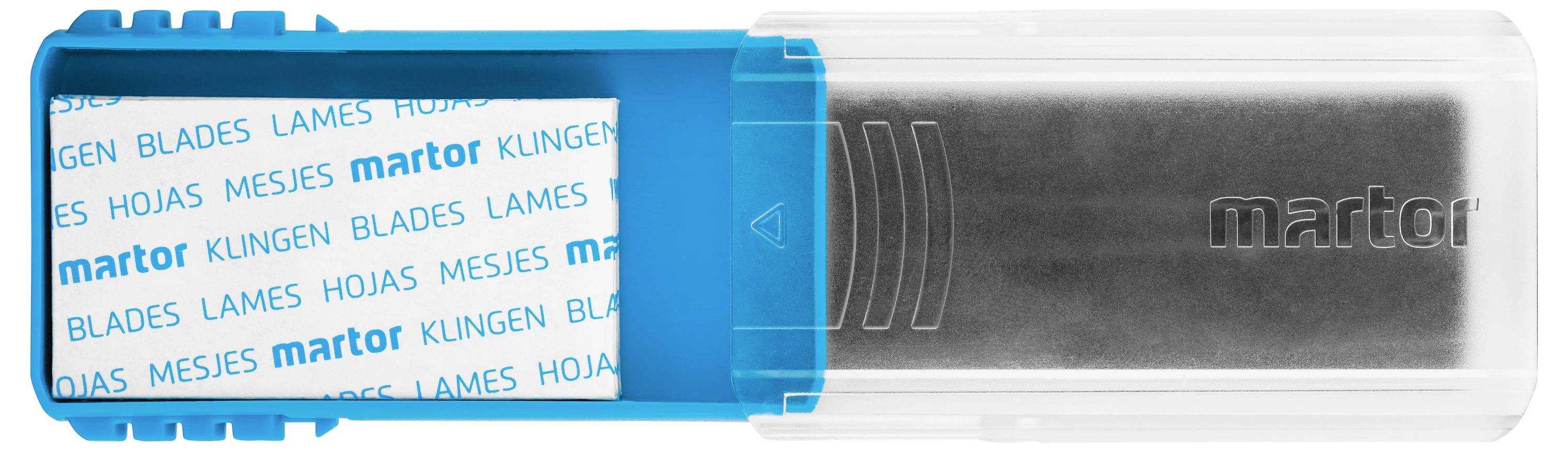 Blue plastic container with a transparent lid, labelled 'martor'. Inside are replacement blades wrapped in white paper.