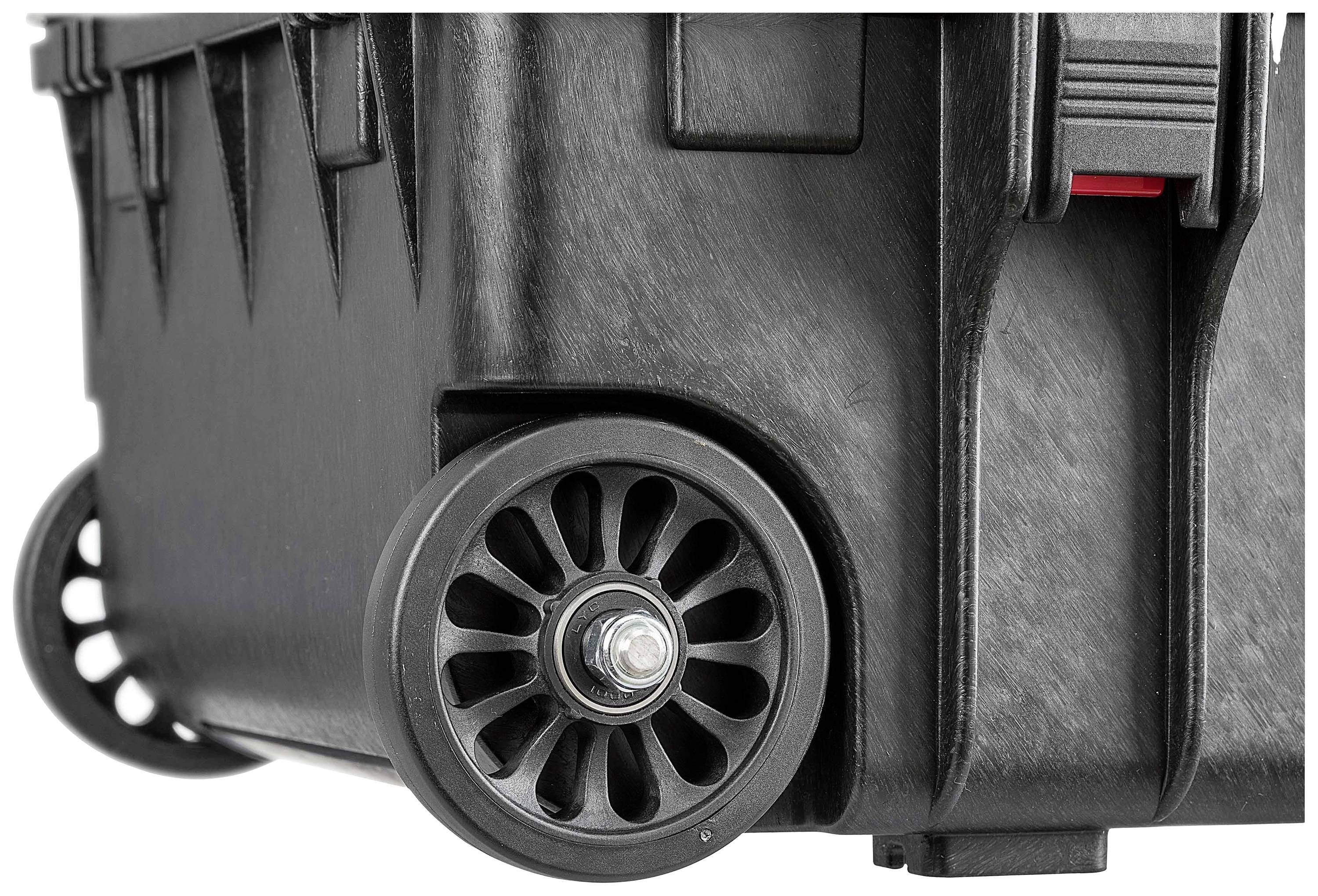Close-up of a black, robust transport case with two large, sturdy wheels.