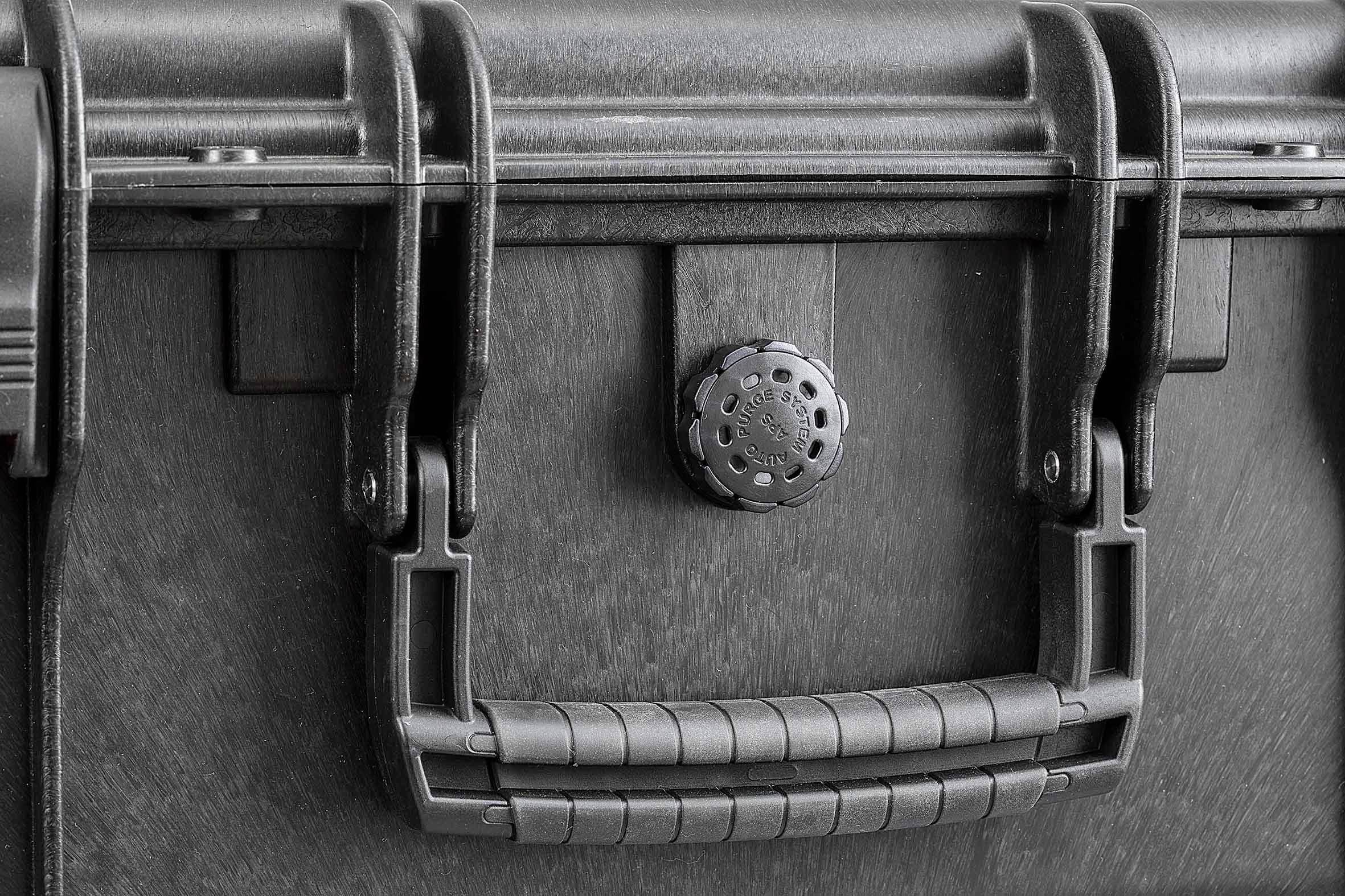 A sturdy black suitcase with a robust handle and secure fastening. Perfect for safe transport or storage.