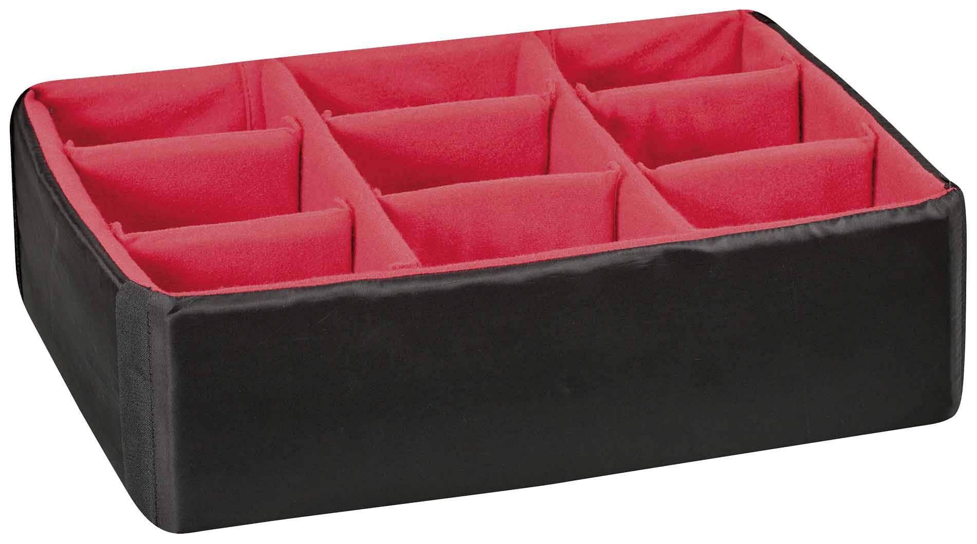 A black box with red interior compartments, divided into a 3x3 grid, for storing or organising small items.