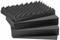 Acoustic foam in pyramid form, stacked. Used for sound absorption, commonly found in studios or home cinemas.