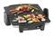 An electric grill with an open grilling surface. Various grilled items: sausages, vegetables and prawns. Perfect for indoor grilling.