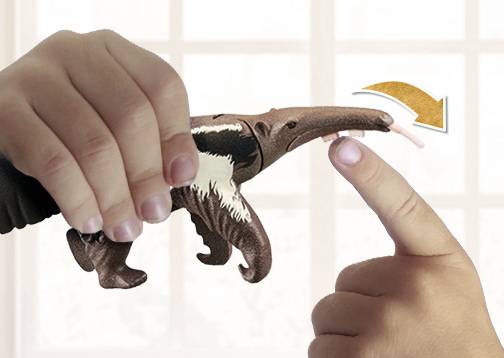 A hand holds an anteater figurine, whose tongue points to an outstretched finger, suggesting interaction or a hall throw.