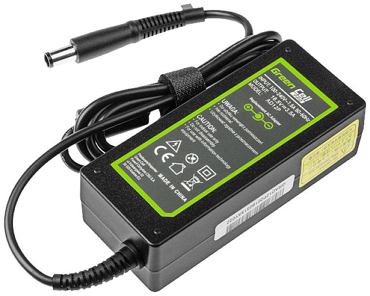 Black laptop power adapter with green 'Green Cell' inscription, technical specifications, and cable with power socket connection.