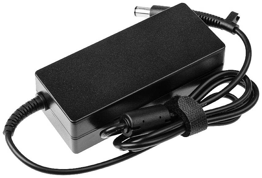 Black laptop charger with cable and connector, coiled and secured with a velcro strap.