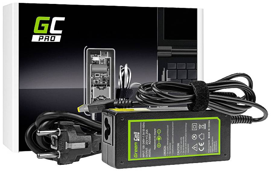 A black laptop power adaptor of the Green Cell Pro model is placed in front of its packaging. It contains various cables and plugs.