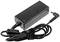A rectangular black laptop power adapter with an attached cable, secured with a cable tie.