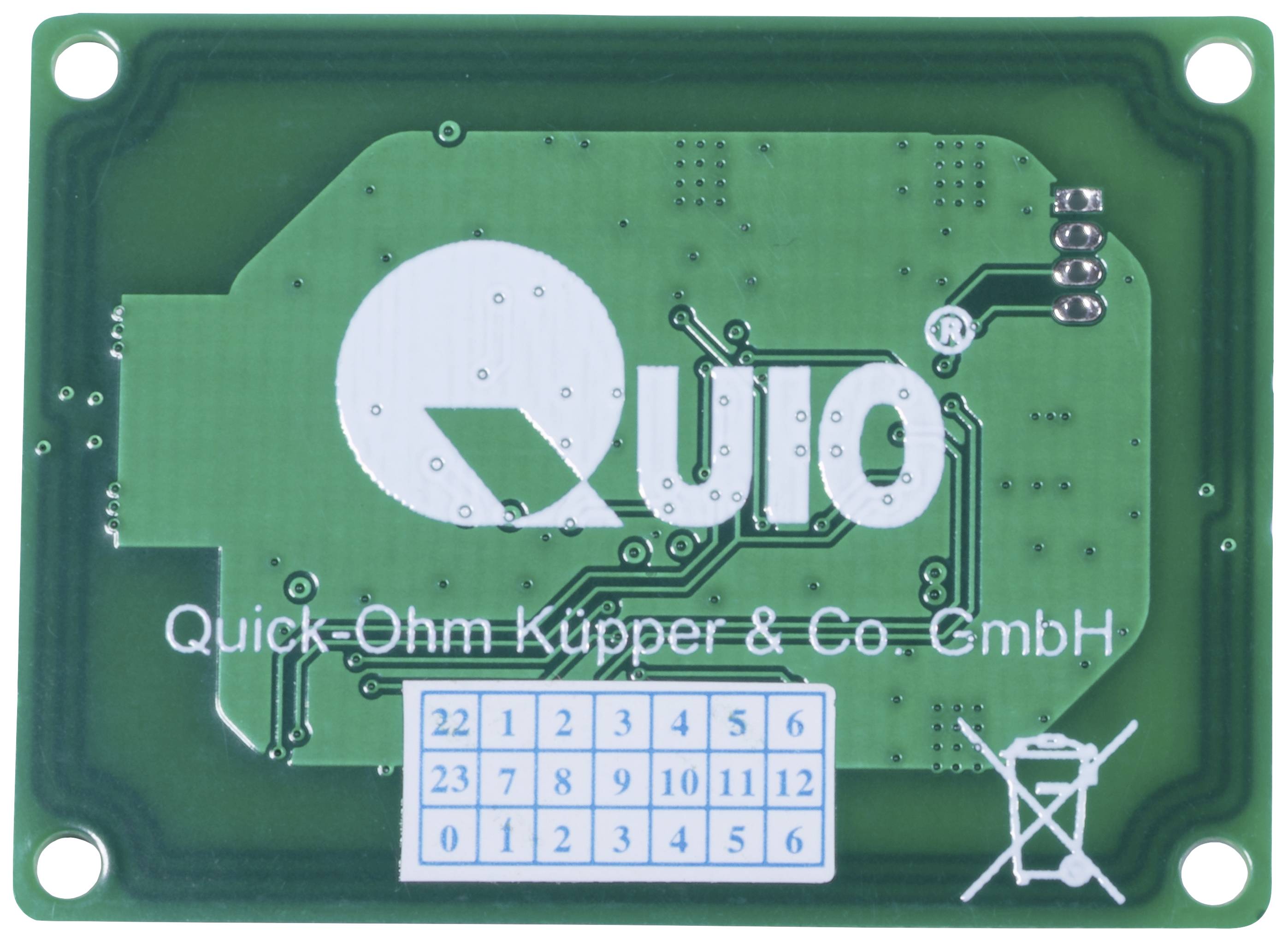 'QUIO' on a green electrical circuit with the text 'Quick-Ohm Küpper & Co. GmbH' underneath. A small numerical field is visible.