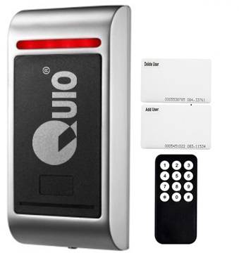 Access control system with a card reader, two white access cards, and a small black remote control with buttons.