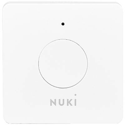 A white, square device with a central button and a small hole above it. The name 'NUKI' is displayed underneath.