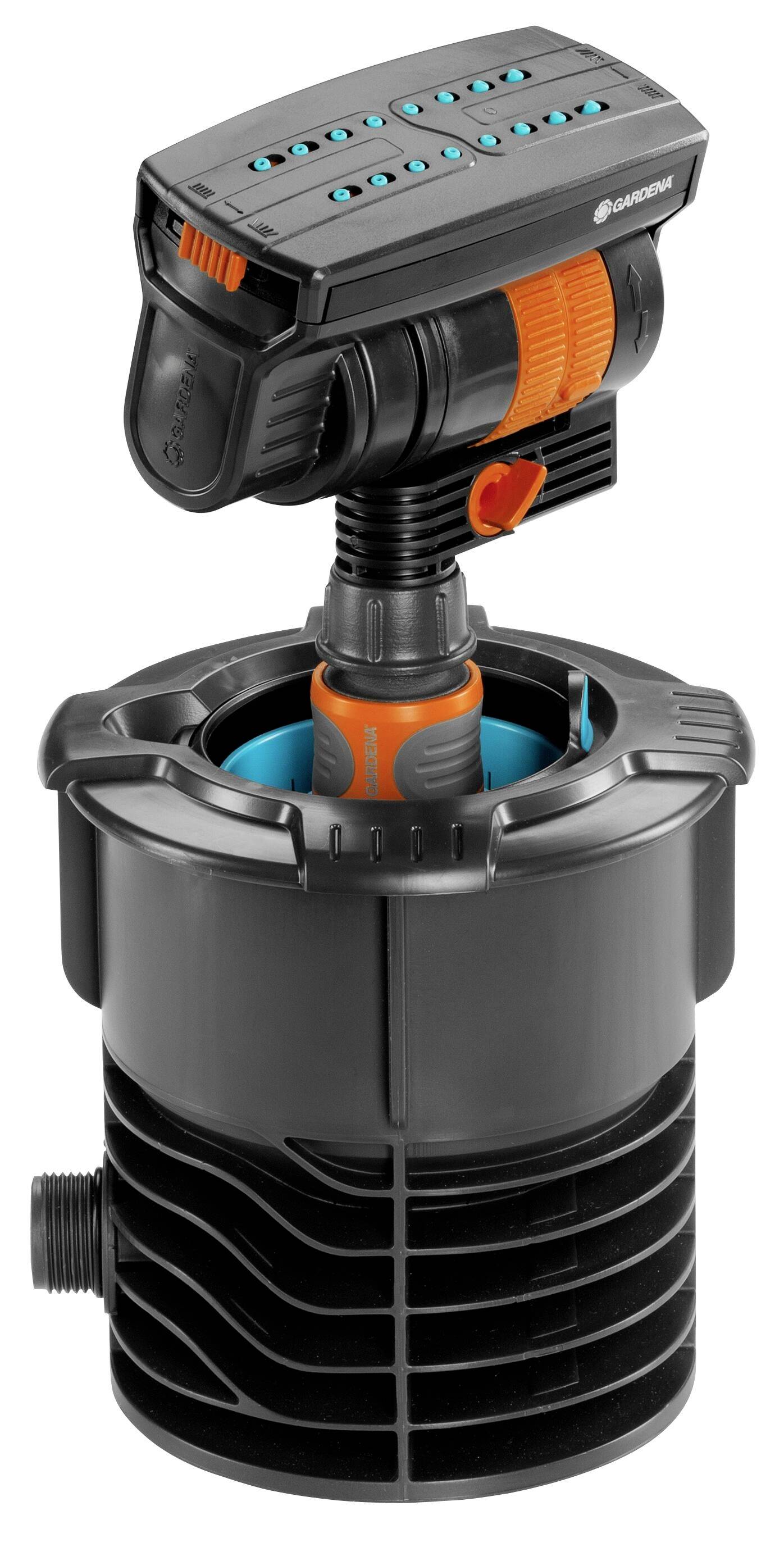Irrigation system pump in a black casing, with orange and blue accents. Several control buttons are located on the top.