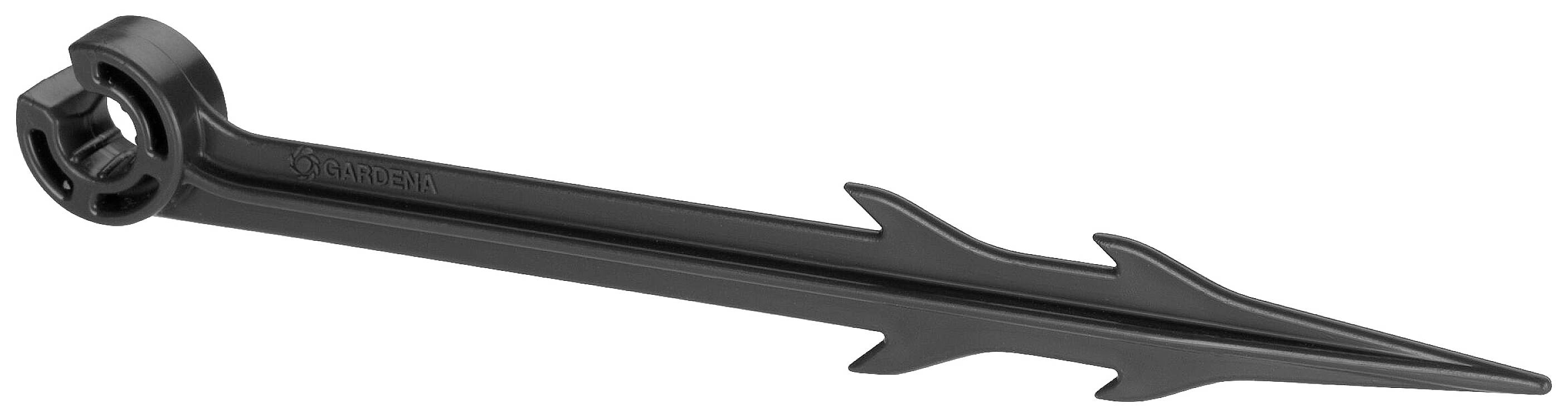 A black plastic ground anchor with serrated fins is used for securing objects to the ground.