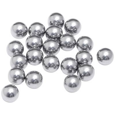 Several silver metal balls are loosely scattered across a white surface.