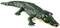 A black toy crocodile with white teeth and a yellow belly is lying on a white background.