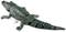 Plastic toy crocodile. It is segmented into multiple parts and displays a green scaled texture.