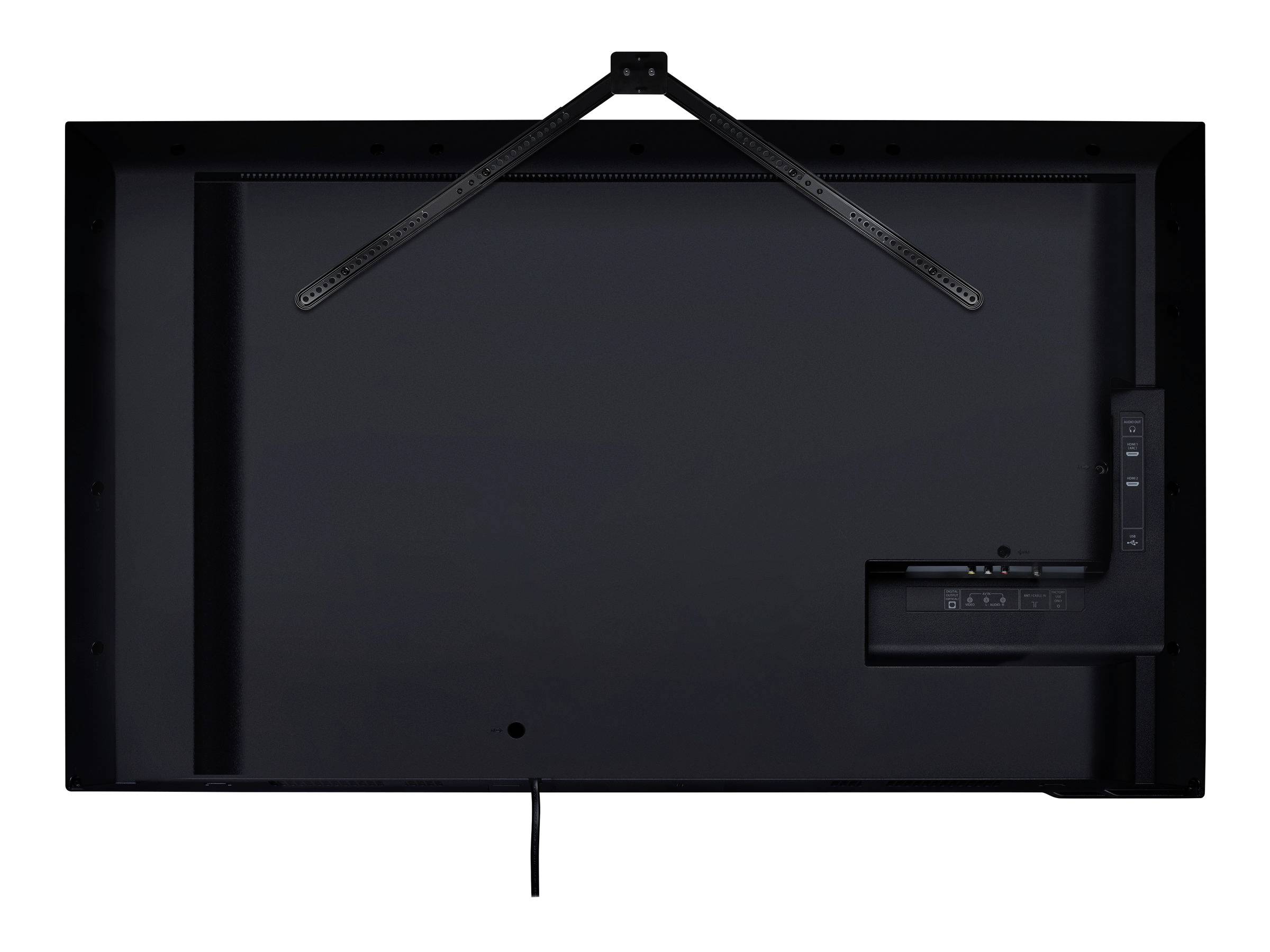 Back of a television with a wall mount and cable connection, predominantly in black.