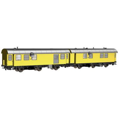 Two yellow railway carriages connected to each other, positioned on tracks, both equipped with round windows and silver roofs.