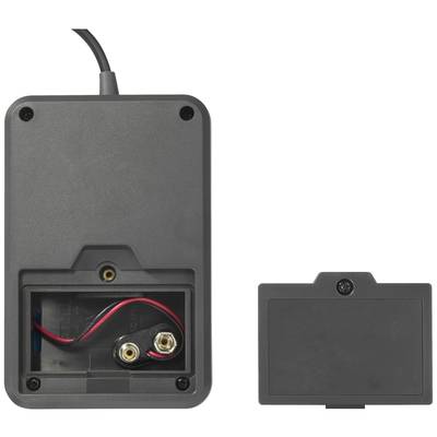 Back of an electronic device with an open battery compartment, showing two plug contacts and loose red and black cables.