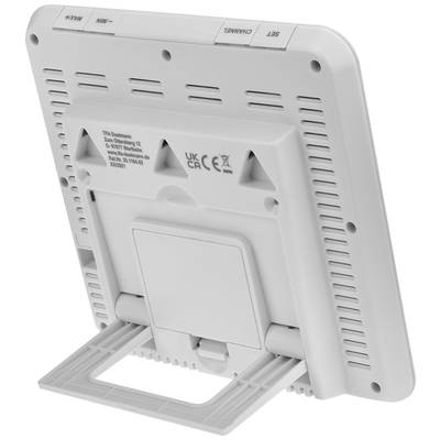 A white, rectangular device with a stand. Rear shows ventilation slots and buttons; labels and symbols visible.
