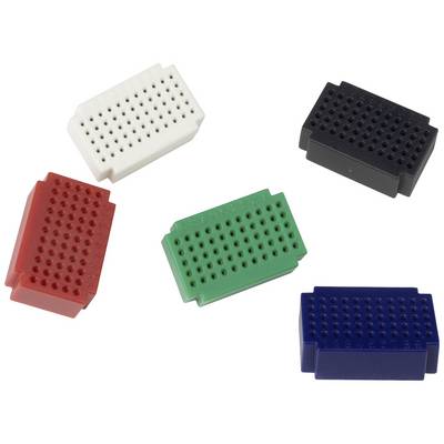 Five small breadboard modules in the colours White, Black, Red, Green and Blue distributed across a white surface.