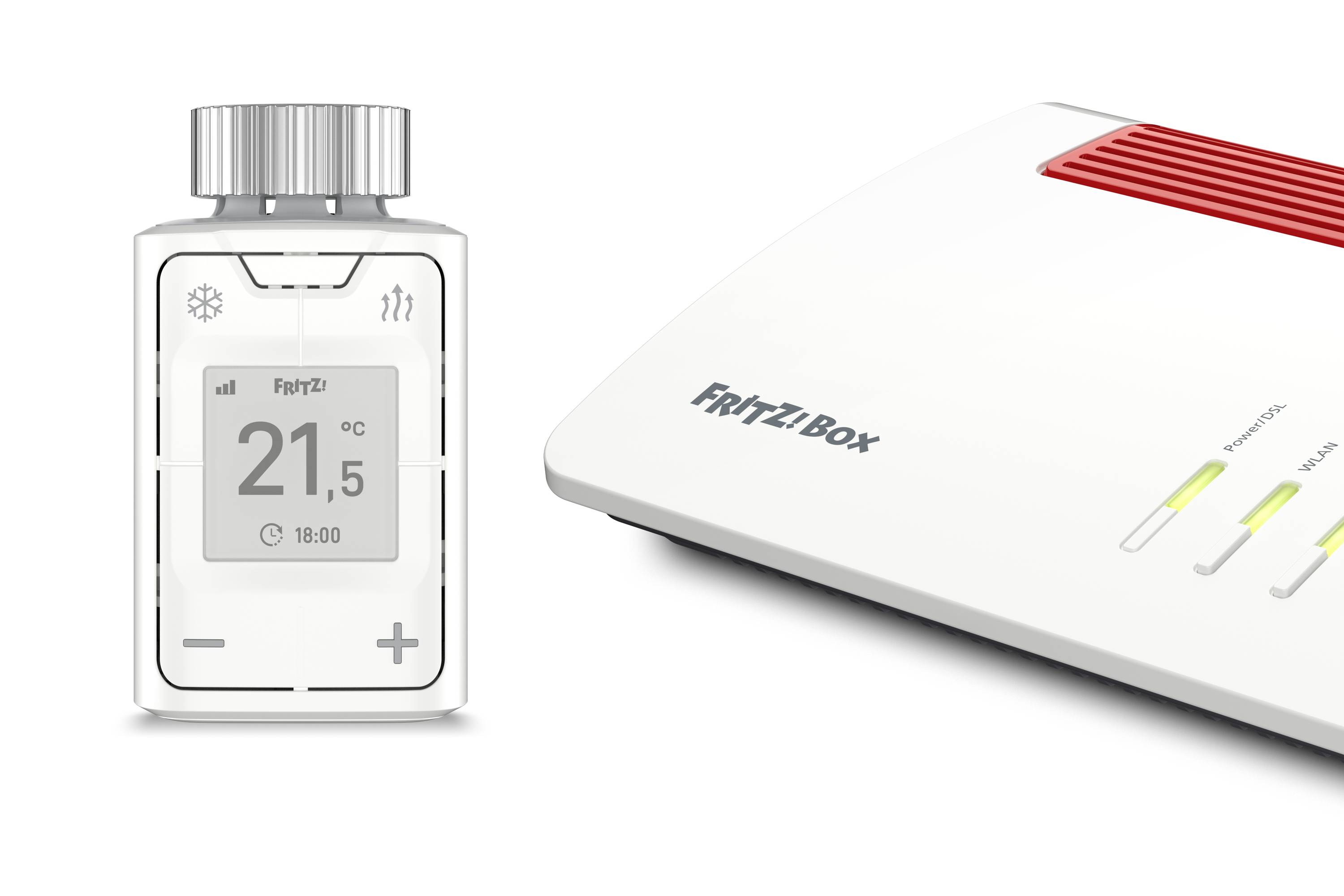 A digital thermostat displays '21.5°C'. Next to it is a white router with a 'FRITZ!Box' label.