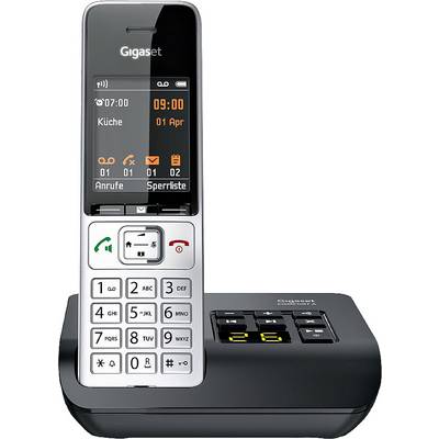 Cordless telephone with charging station. Screen displays date, time and status bar. Buttons for call answer and navigation menu.