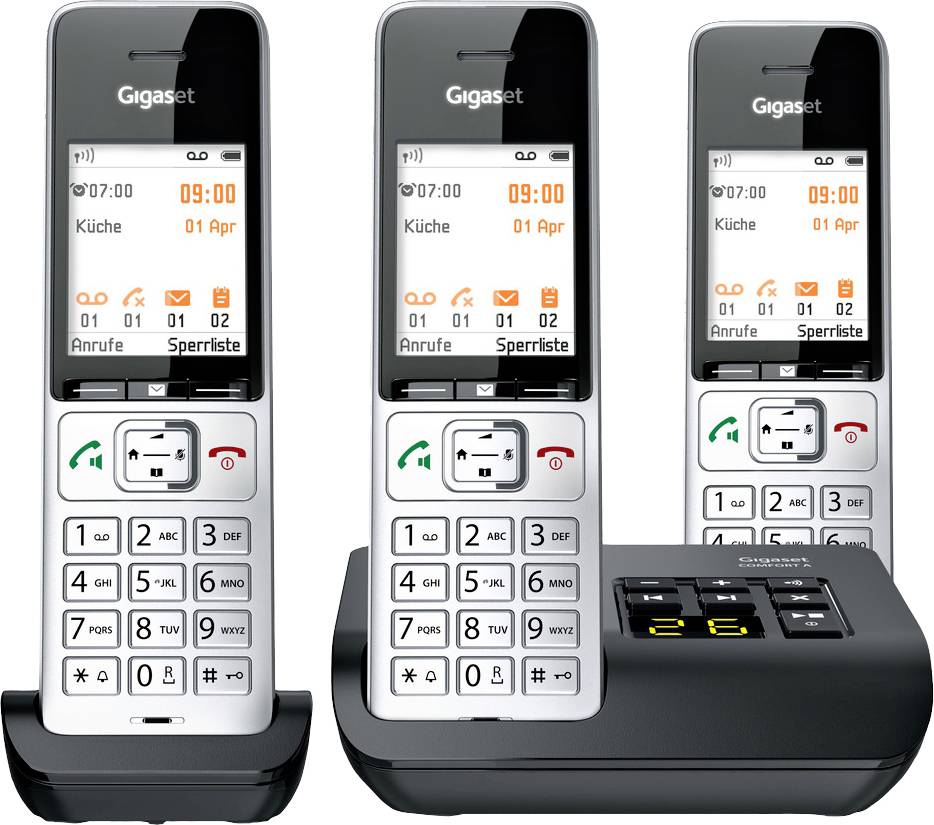 Three cordless phones with base station. Displays show 'Kitchen' and date. Devices are in charging cradles.