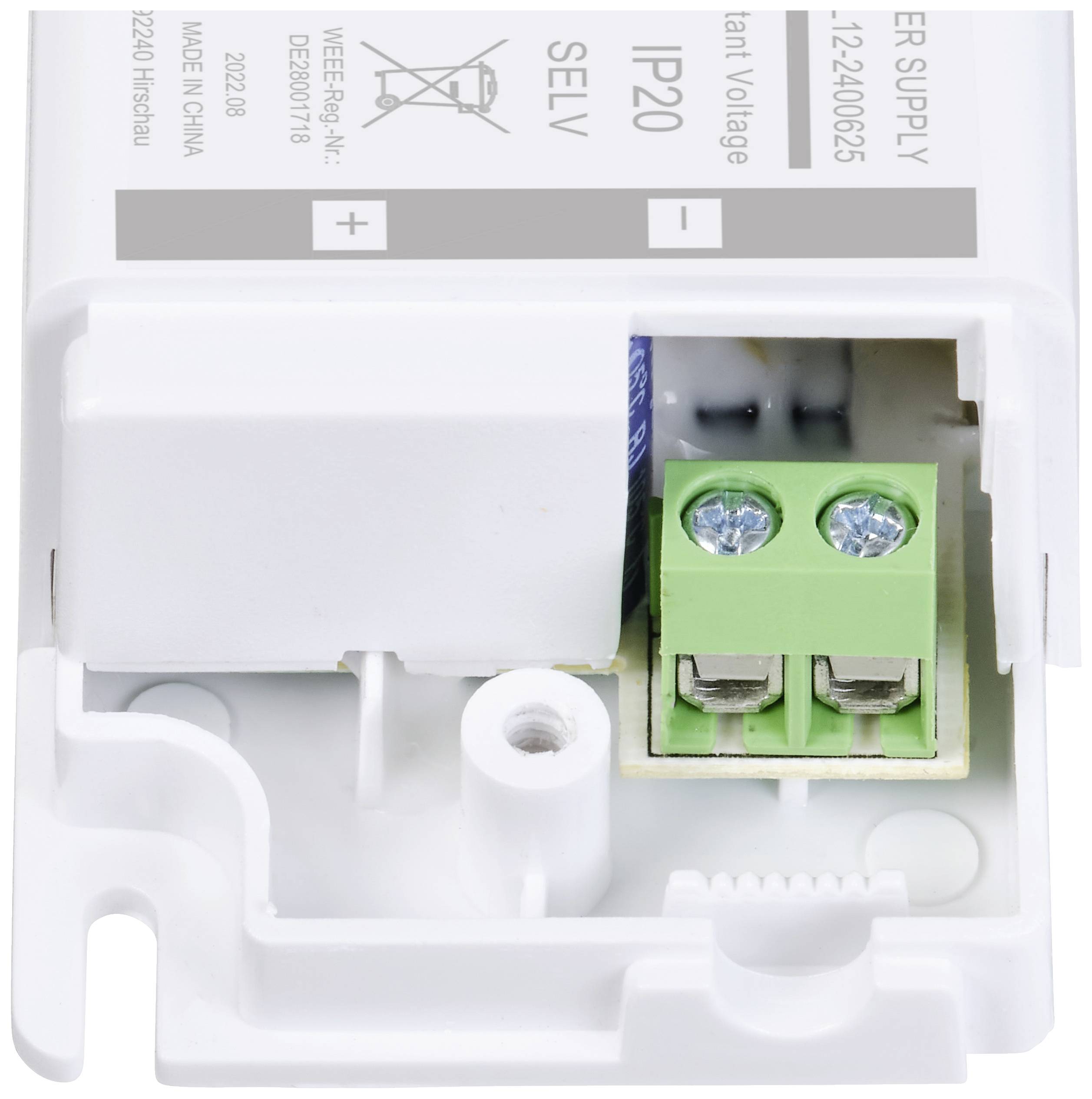 White plastic housing of an LED transformer, showing connections and label '12-24VDC', IP20, suitable for indoor applications.