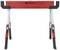 Red and black tool stand by Toolcraft, with adjustable legs and folding mechanism, standing upright.