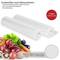 'Two replacement vacuum-sealing rolls, 28 cm x 6 m. Suitable for cooking and microwave use. Prevents freezer burn. Vegetables in the foreground.'