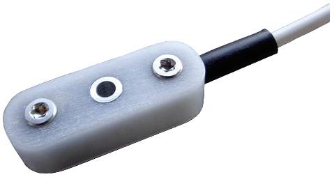 A rectangular, flat sensor with two screws for mounting and a cable connection for data transmission.