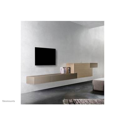 Wall-mounted, modern living room setup with a floating television, low console, and bookshelf, minimalist design.