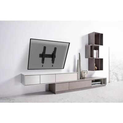 Wall-mounted television with adjustable bracket above a modern white and brown entertainment unit in a stylish, minimalist room.