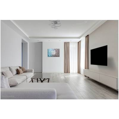 Bright living room with a grey sofa, large black flatscreen television mounted on the wall, wooden flooring and natural daylight streaming through large windows.
