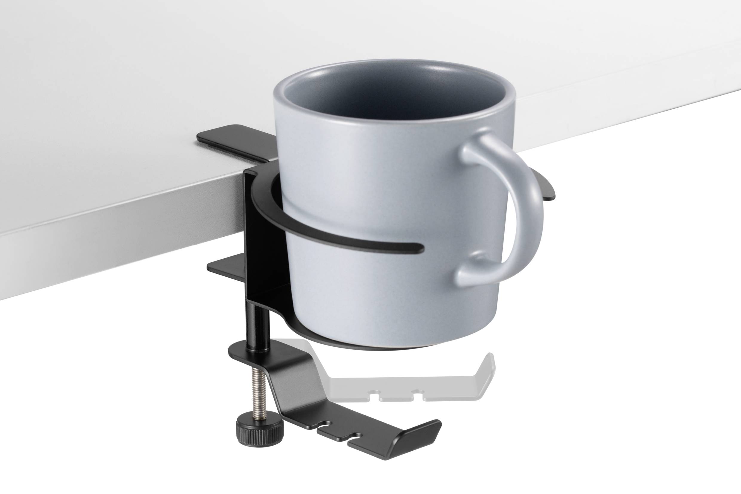 A grey mug sits in a black mug holder attached to the edge of a white table.