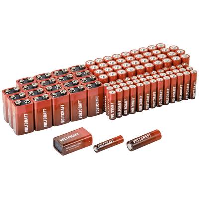 A collection of batteries, including rectangular 9V batteries and cylindrical AA batteries, each labelled 'Voltcraft'.