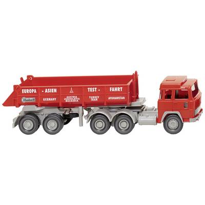 Toy lorry in red with the inscription 'Europe - Asia Test Drive'. Countries such as Germany and Turkey are listed on the cargo area.