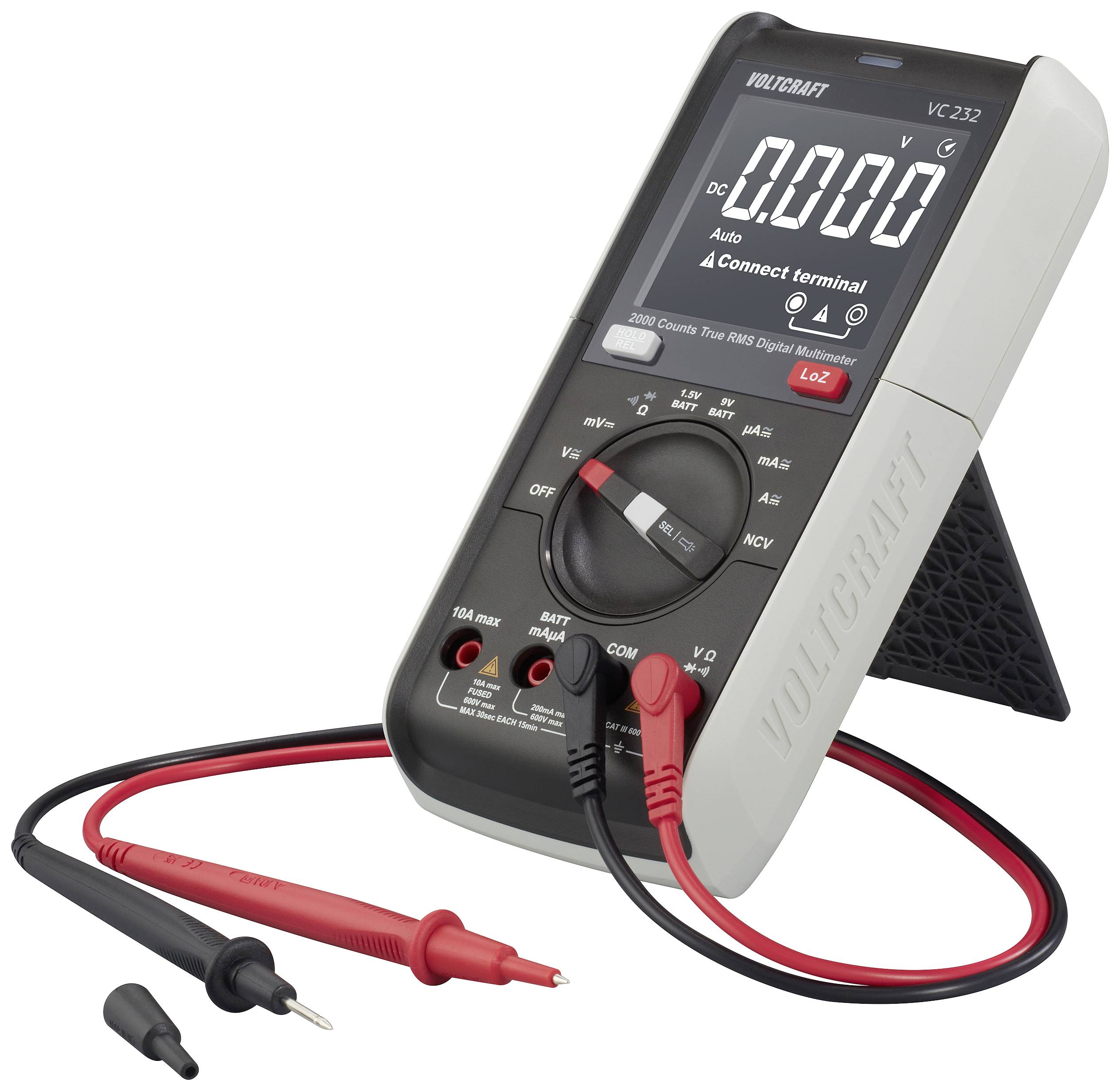 Digital multimeter with display, showing "0.000" in volts. Two test leads connected, red and black. Device standing on a support base.
