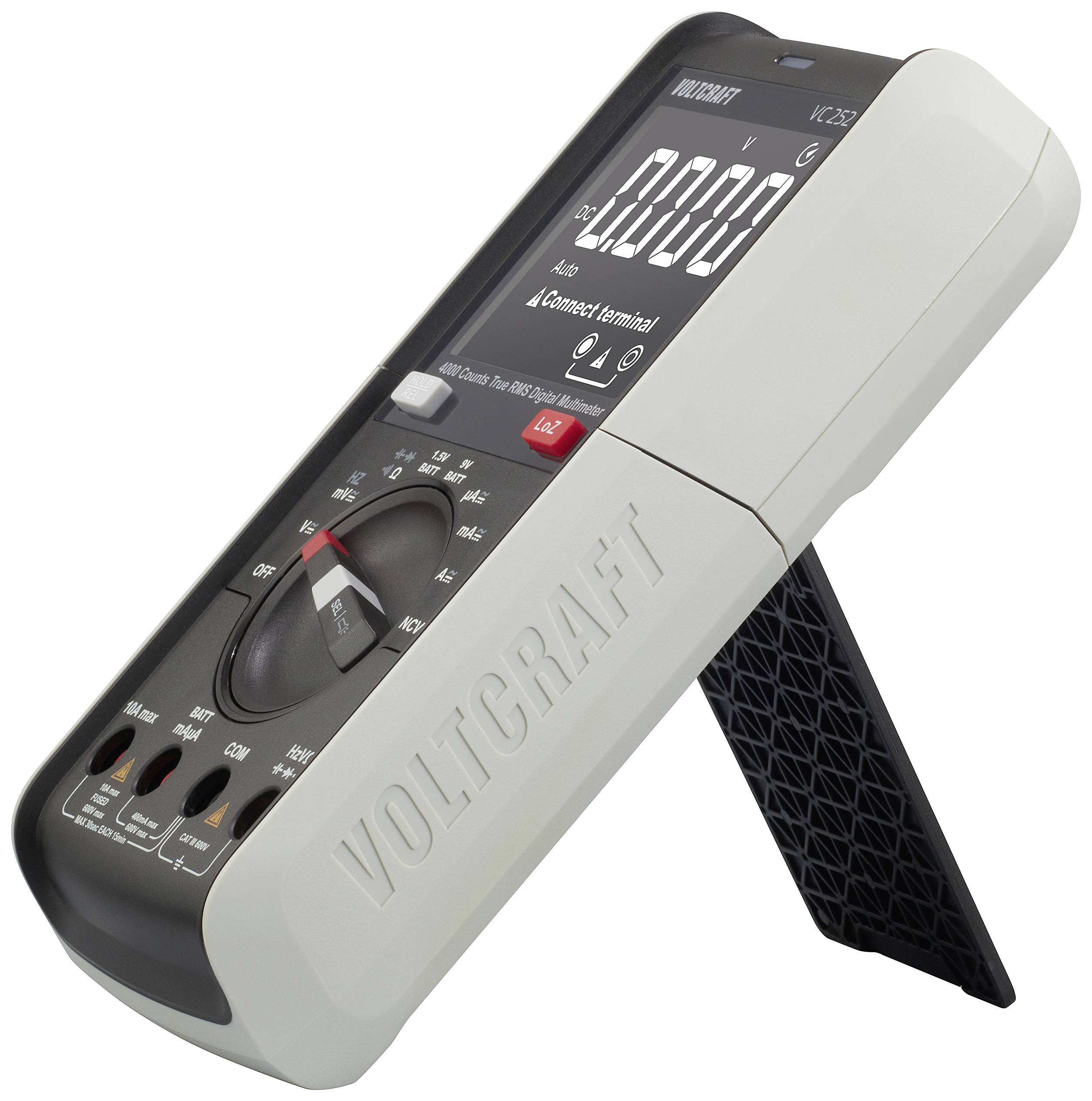 A grey digital multimeter with a black display, showing readings. The brand name 'Voltcraft' embossed on the right.