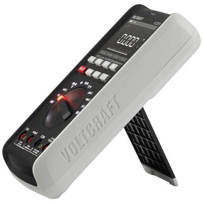 Digital multimeter by Voltcraft, model VC276. Angled view showing display, rotary switch and stand.