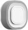 A modern, circular air quality monitoring device with a grey fabric surround and a central white display.