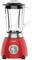 A red standing blender with a transparent mixing jug and silver control dial.