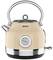 Electric kettle in cream-coloured retro style with temperature display and gleaming accents.